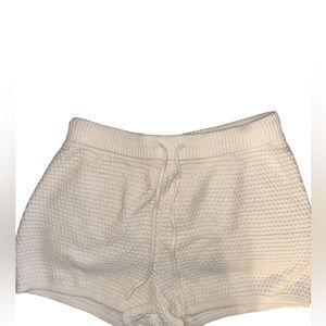 White draw string knitted shorts.